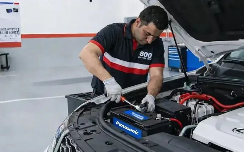 Certified technician performing secure Hyundai battery replacement